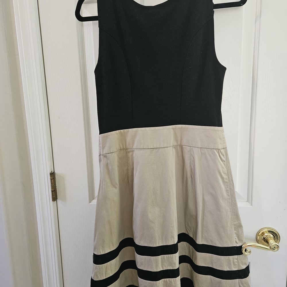 The Limited Black Sleeveless Top with Ruffle Detail